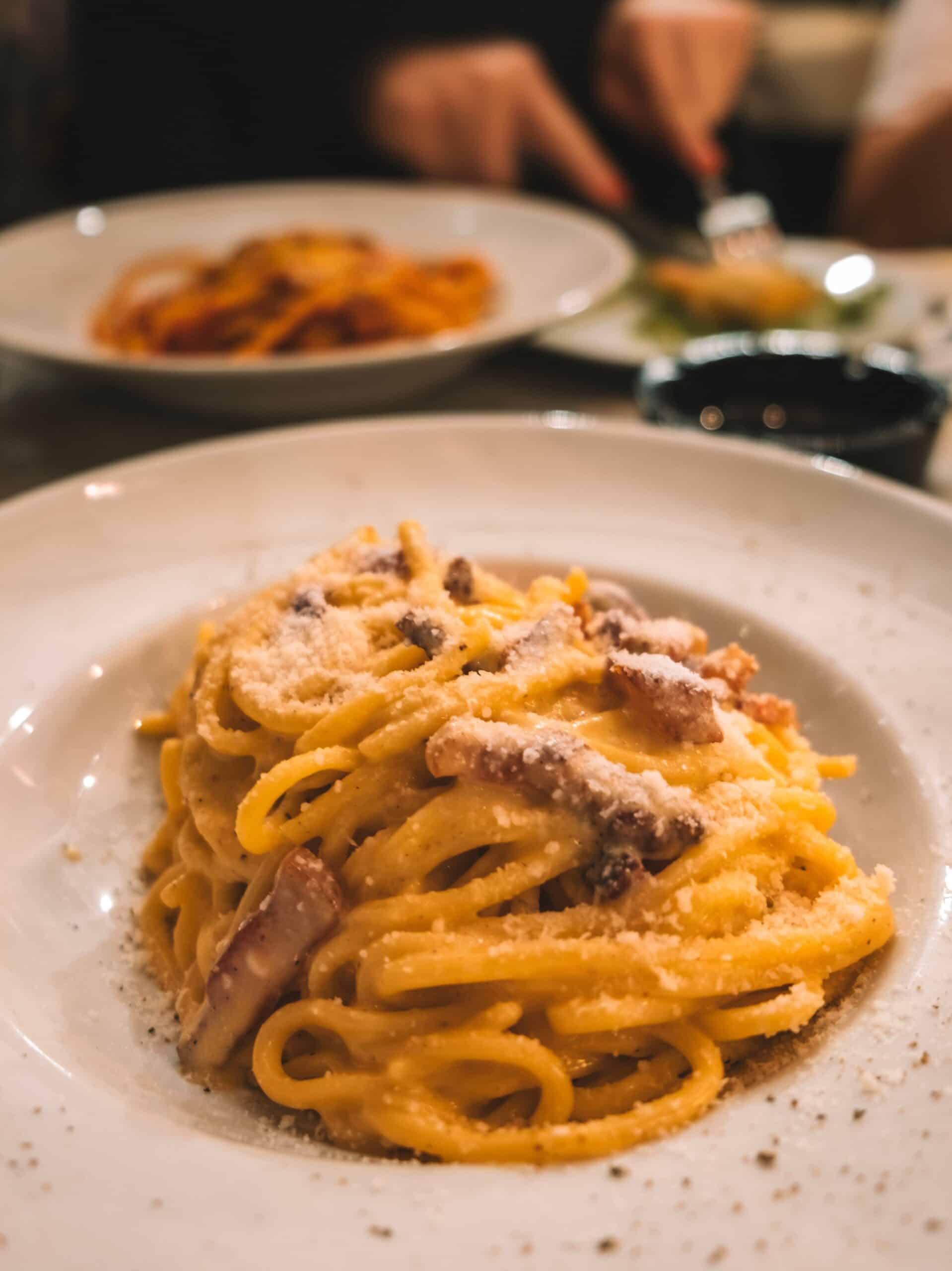 A yummy plate of carbonara from Trattoria Sora Cencia. This is one of the best restaurants in Trastevere Rome. 