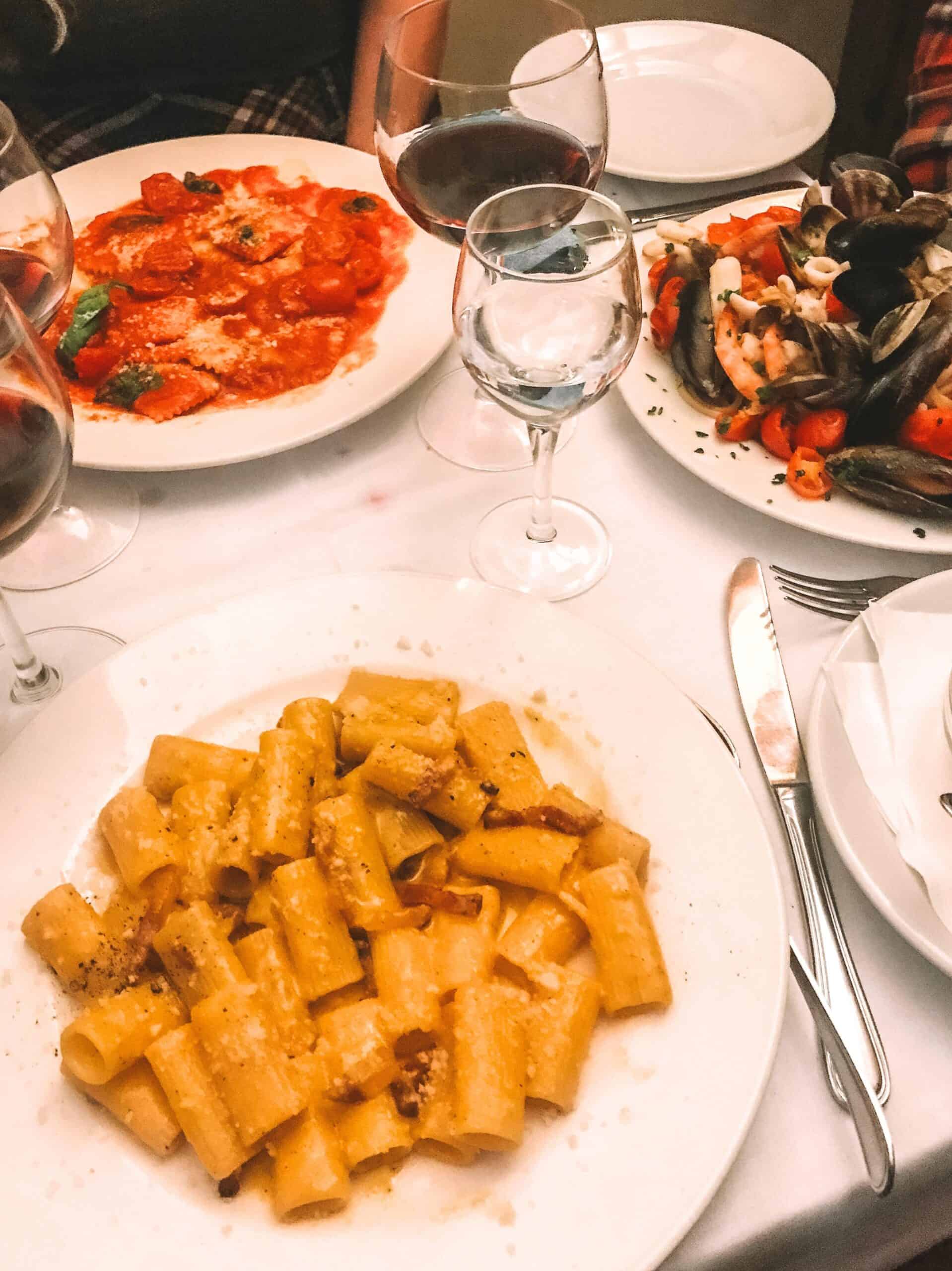 Carbonara, ravioli, and seafood spaghetti from Trattoria da Teo – one of the the best restaurants in Trastevere for fresh, authentic pasta.