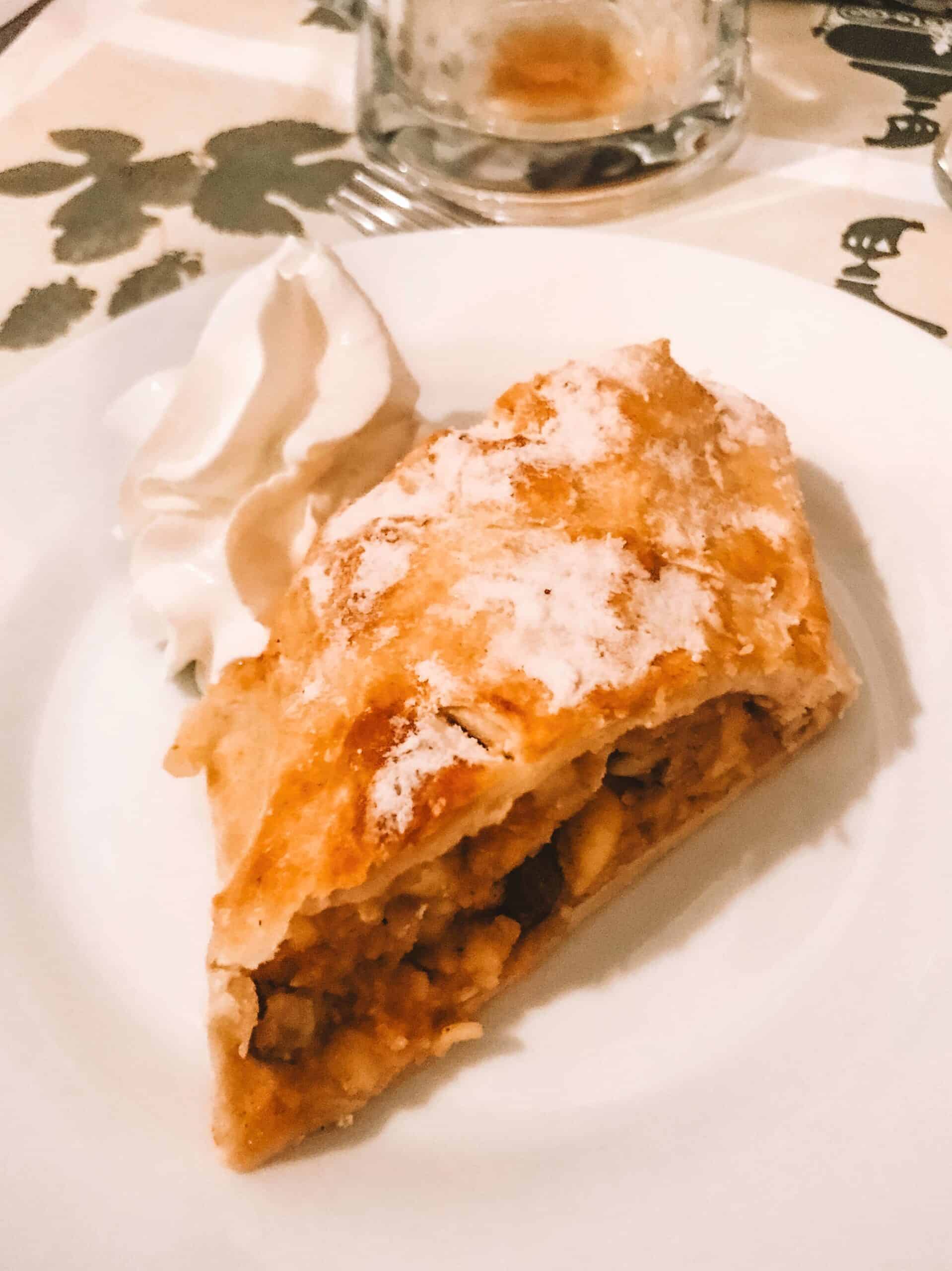 A piece of apple strudel with homemade whipped cream from U Fleku.