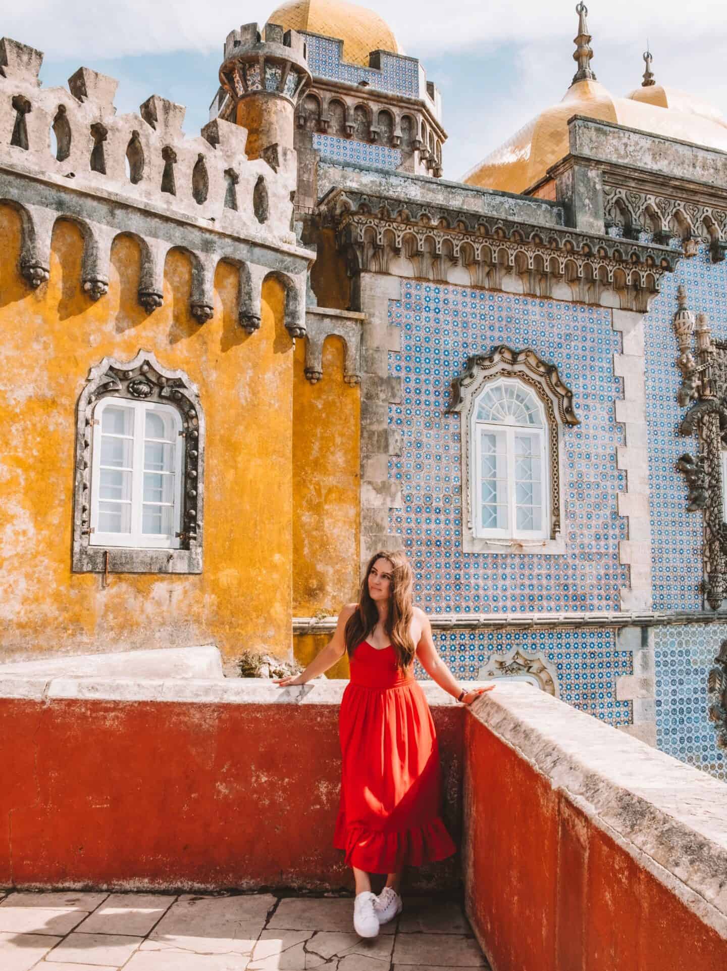 Me in front of the Pena Palace's yellow, red, and blue domes. 
