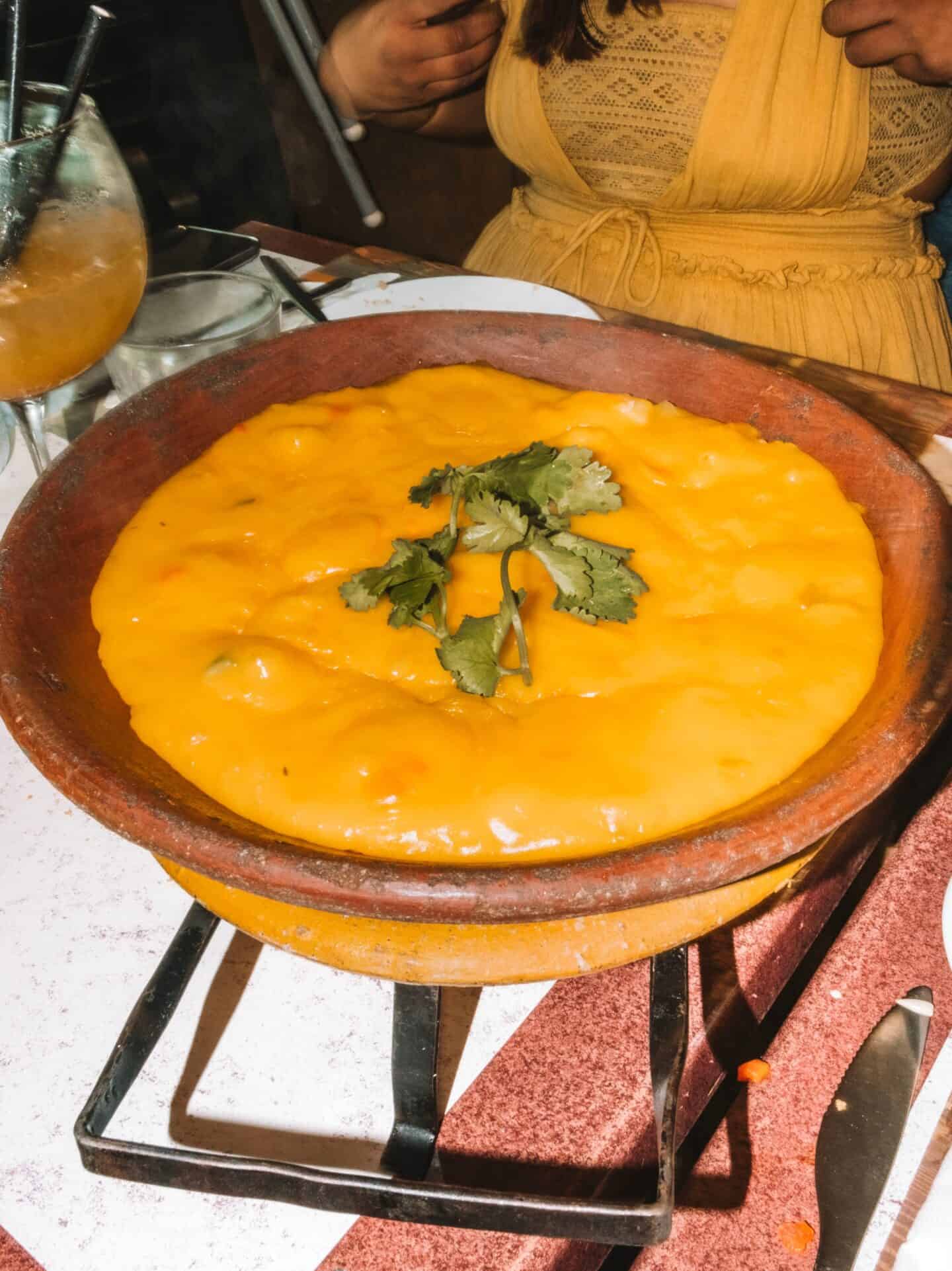 A piping hot bowl of bobó de camarão from Acarajé da Carol in Bairro Alto. Trying Brazilian cuisine is a must during your 5 days in Lisbon. 