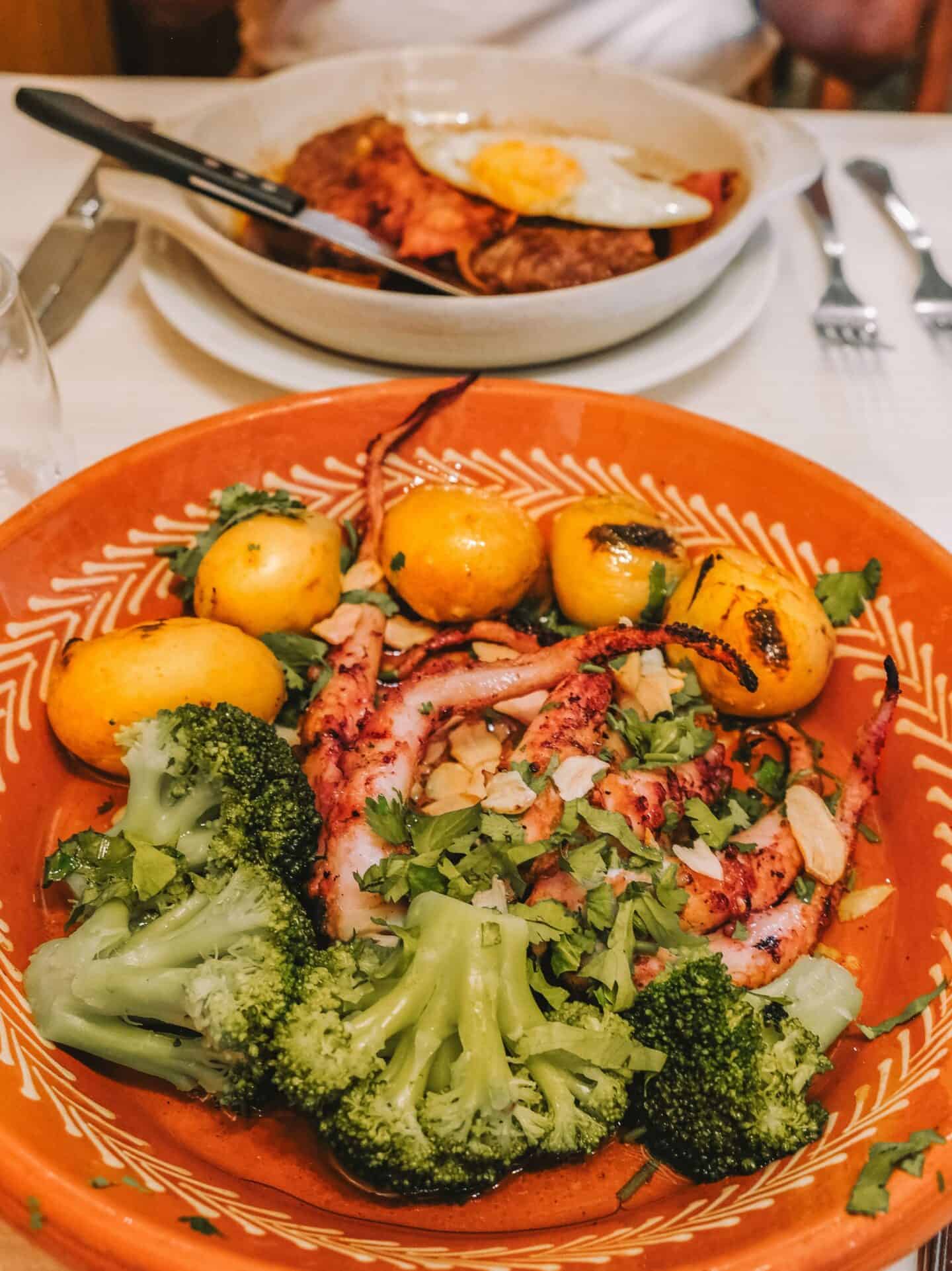 A plate of grilled octopus and potatoes from Andorinhas in Belem. 