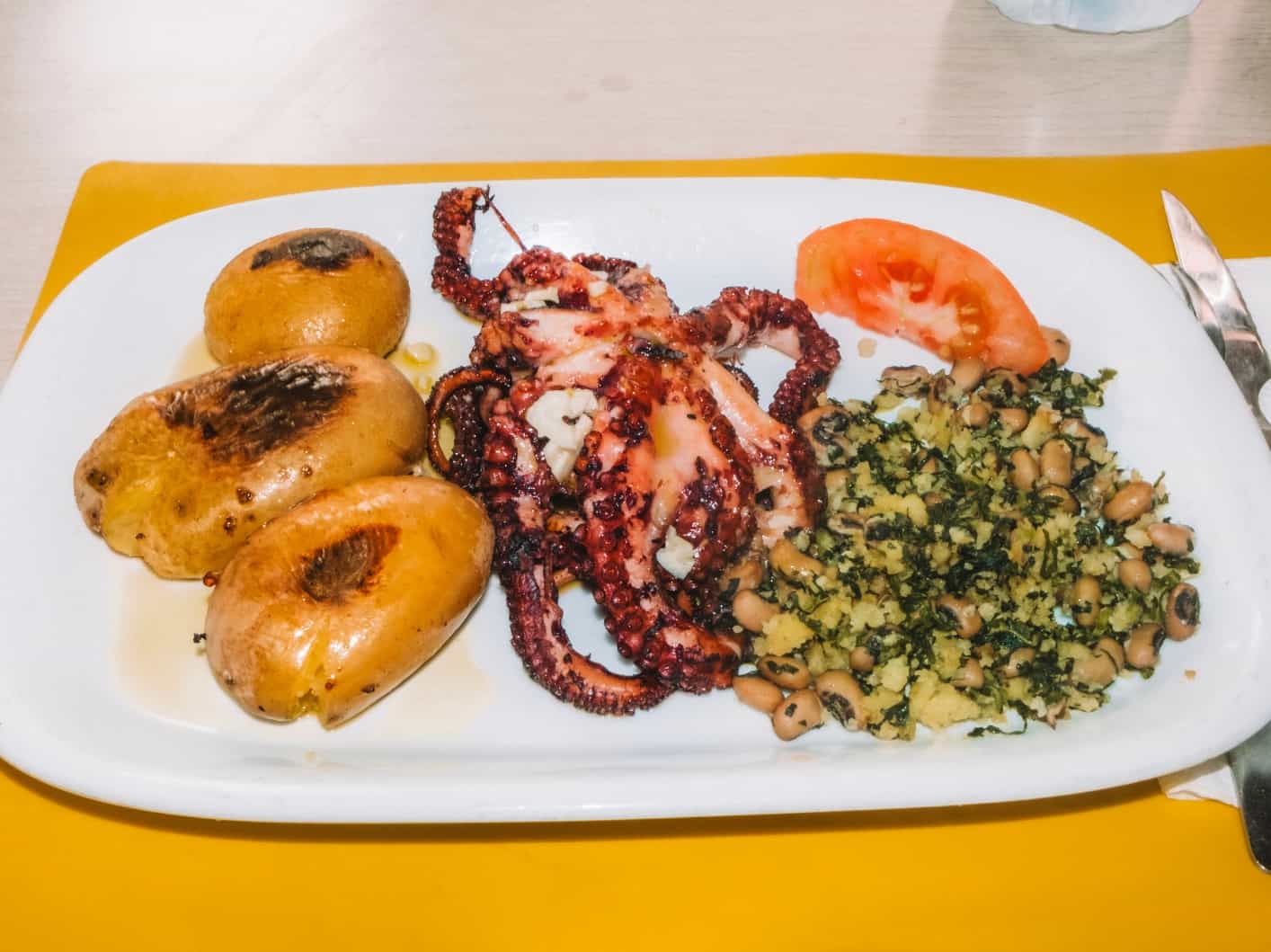 My favorite meal to try with 5 days in Lisbon – grilled octopus and potatoes from Santo Andre in Alfama. 