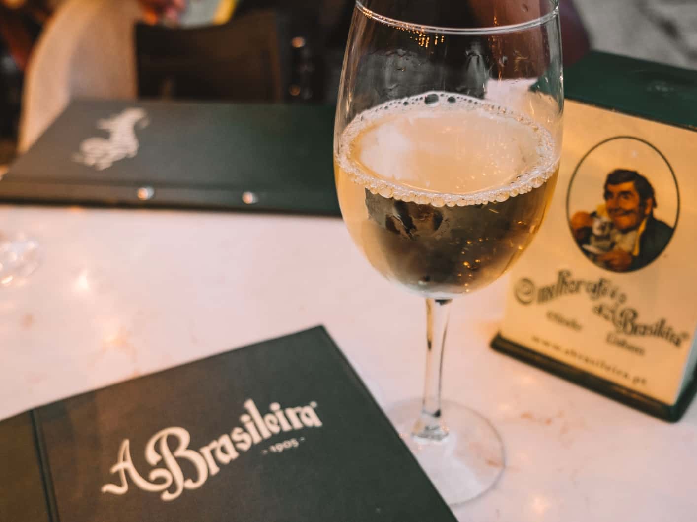 A glass of vinho verde at A Brasiliera – one of the most historic bars in Lisbon. 