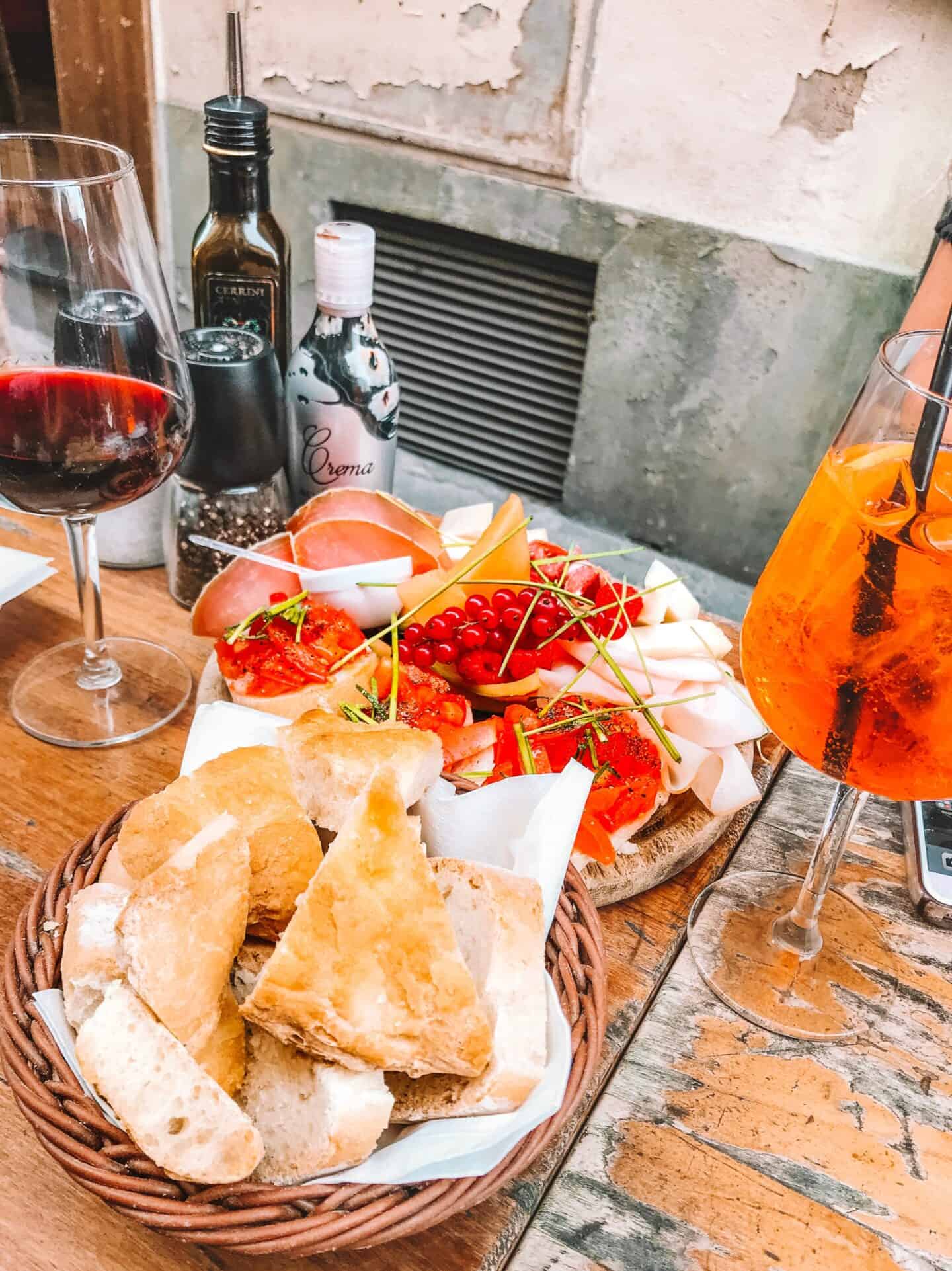 A gorgeous antipasto tray with wine and an Aperol Spritz from Note di Vino – one of the best places to eat in Florence 
