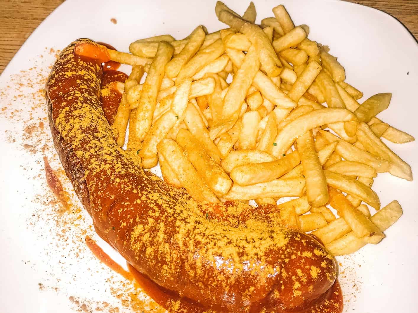 A delicious plate of currywurst and fries from Steinheil 16 – easily one of the best Bavarian restaurants in Munich 