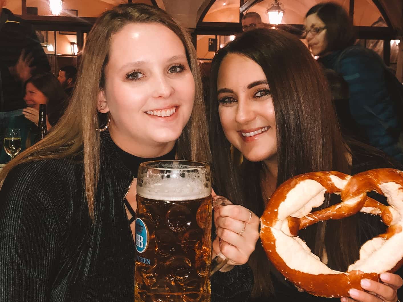 My bestie and I drinking beer and eating pretzels at Hofbrauhaus in Munich 
