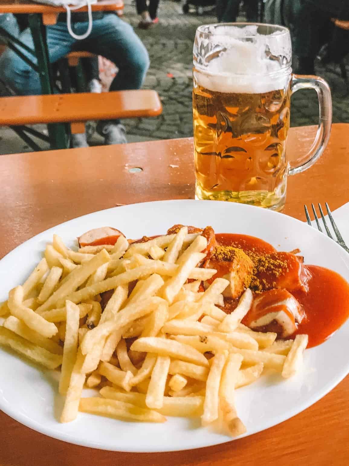 Currywurst, fries and an icy German beer from the Viktualienmarkt, the best food market in Munich 
