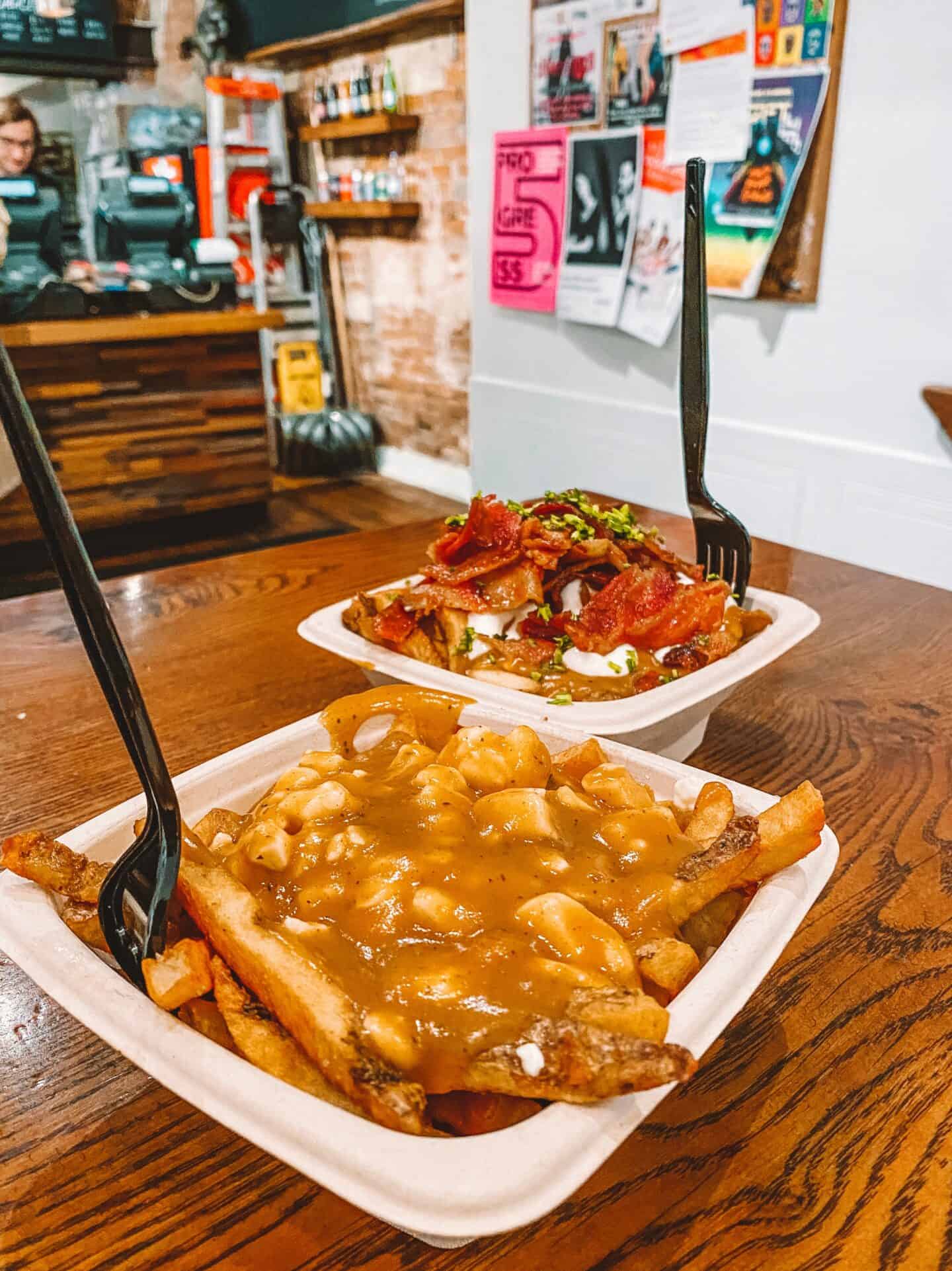 Two heaping helpings of poutine from Poutini's House of Poutine in Toronto's liberty village 
