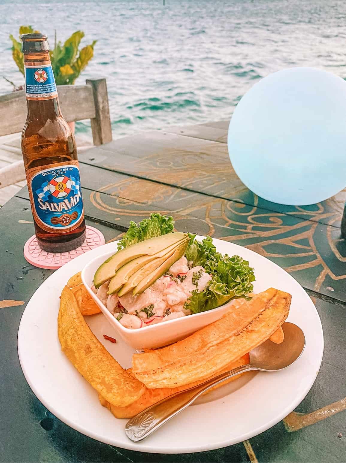 A delicious dinner of lionfish ceviche and fried plantains at Utila's Mango Tango restaurant
