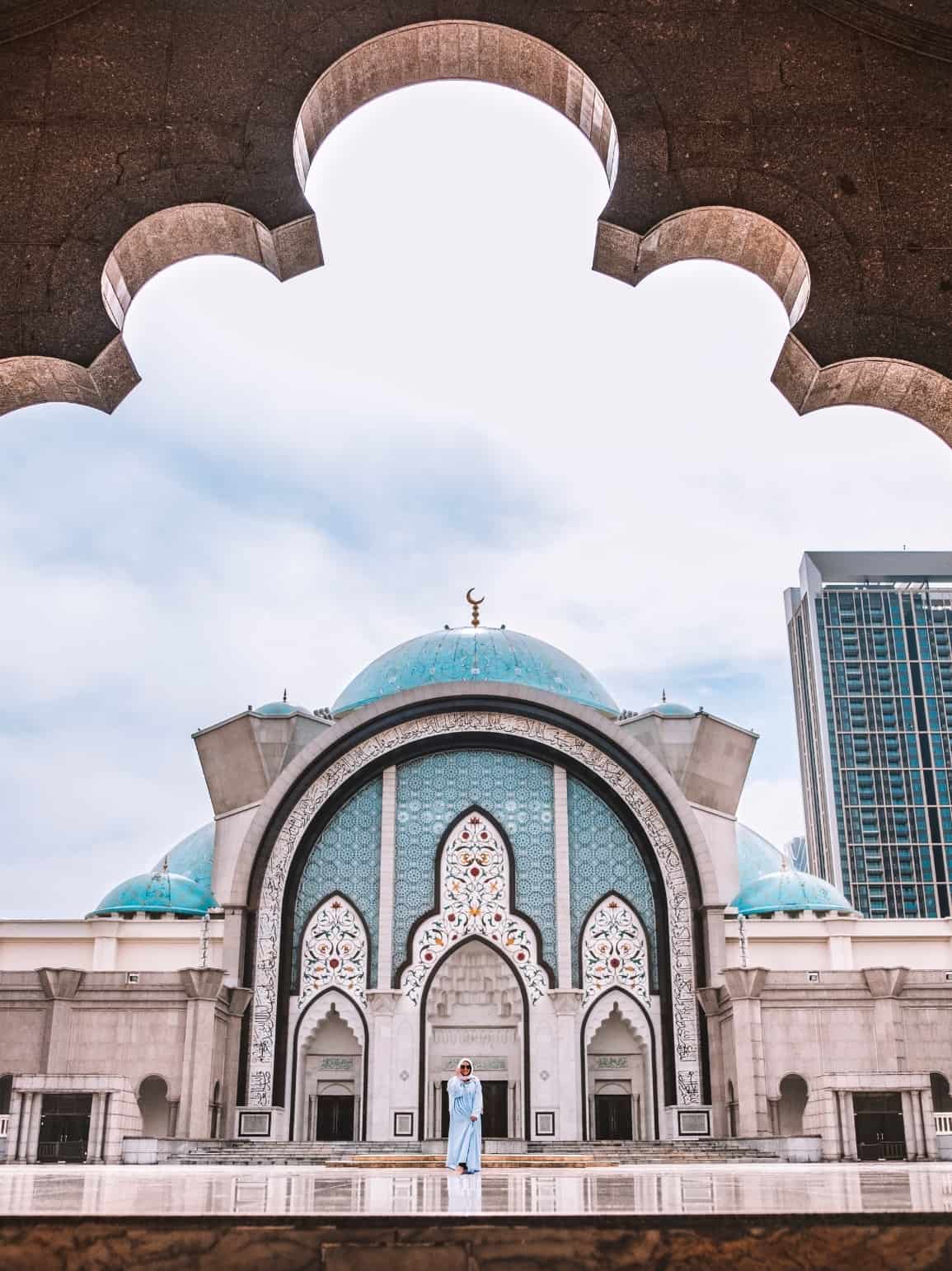Me touring a beautiful mosque in Kuala Lumpur Malaysia