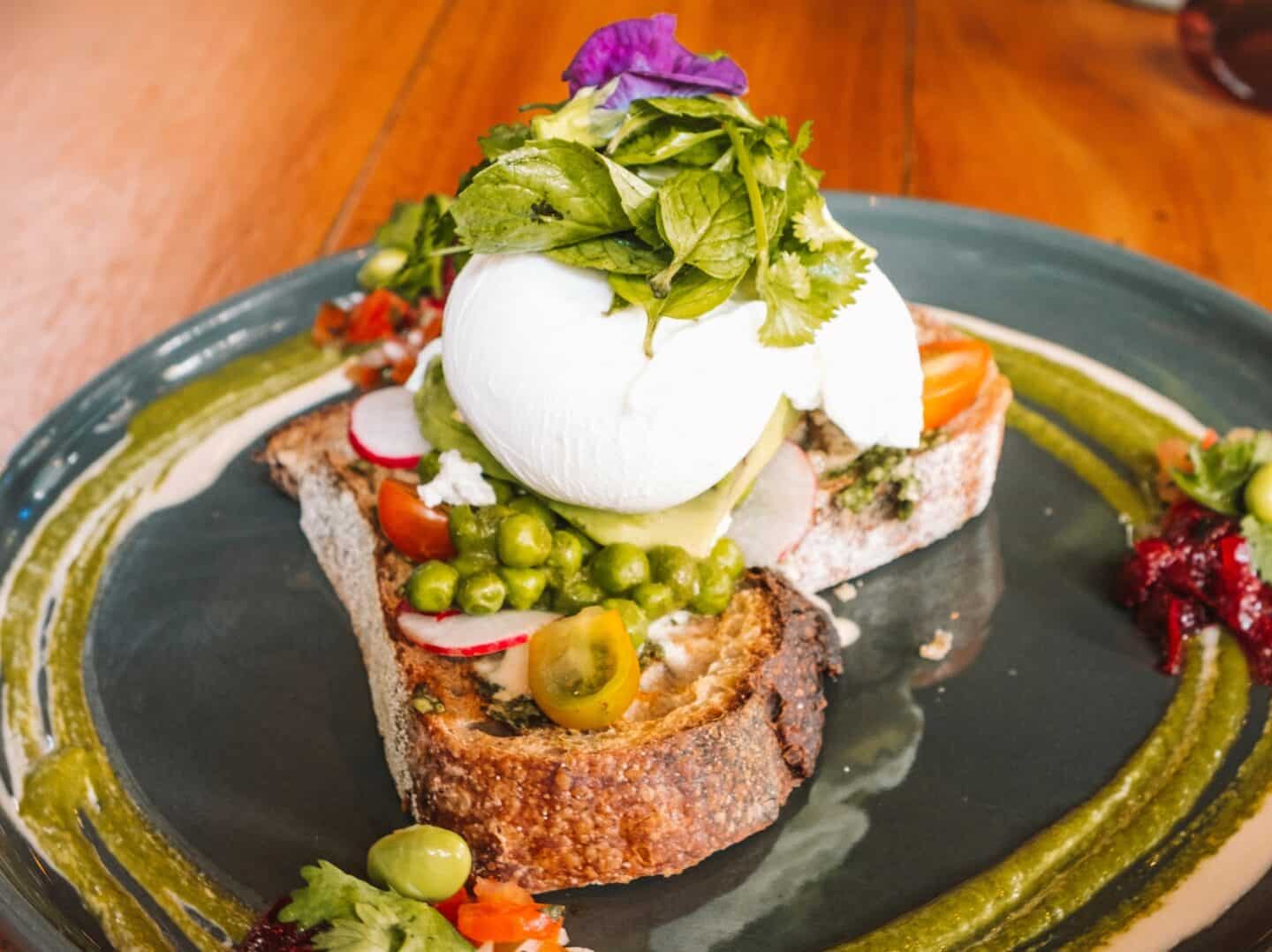 A twist on avocado toast with peas and whipped tahnini from Cafe Vida in Canggu