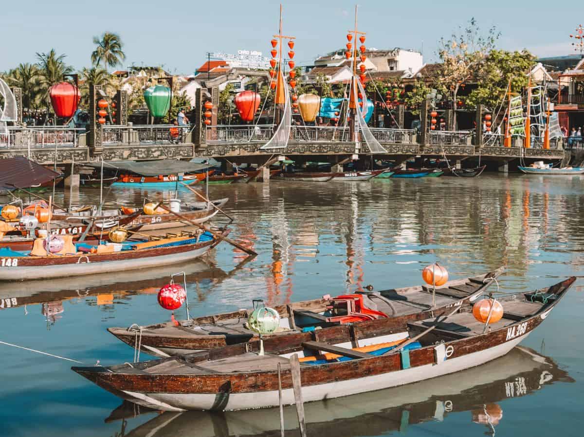 Rowboats on the Thu Bon River in Hoi An decorated in colorful lanterns.