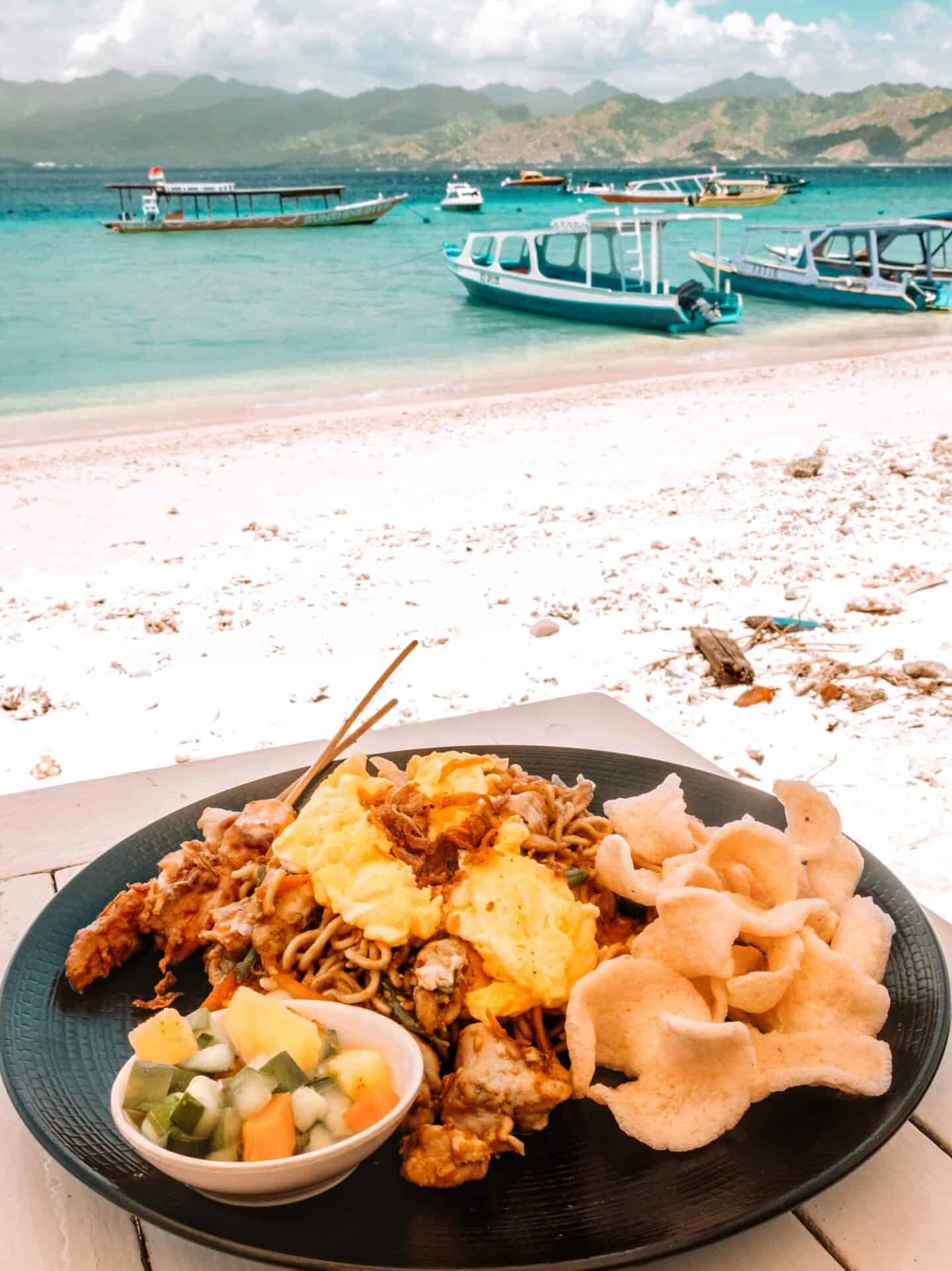 A piping-hot plate full of mie goreng from Scallywags Seafood Bar & Grill on Gili T with an ocean view