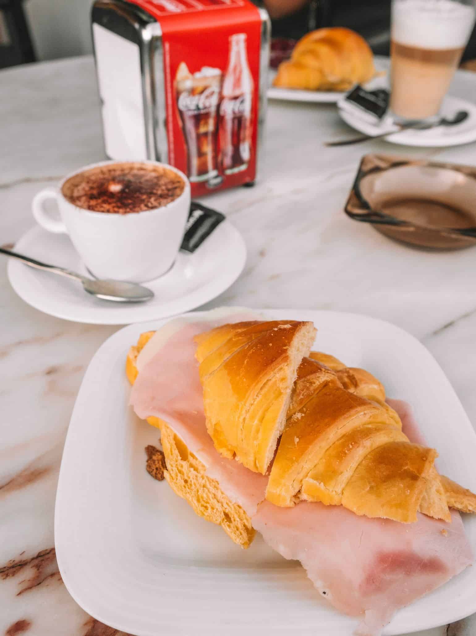 A fluffy croissant and a cappuccino enjoyed in Amarante, Portugal. 