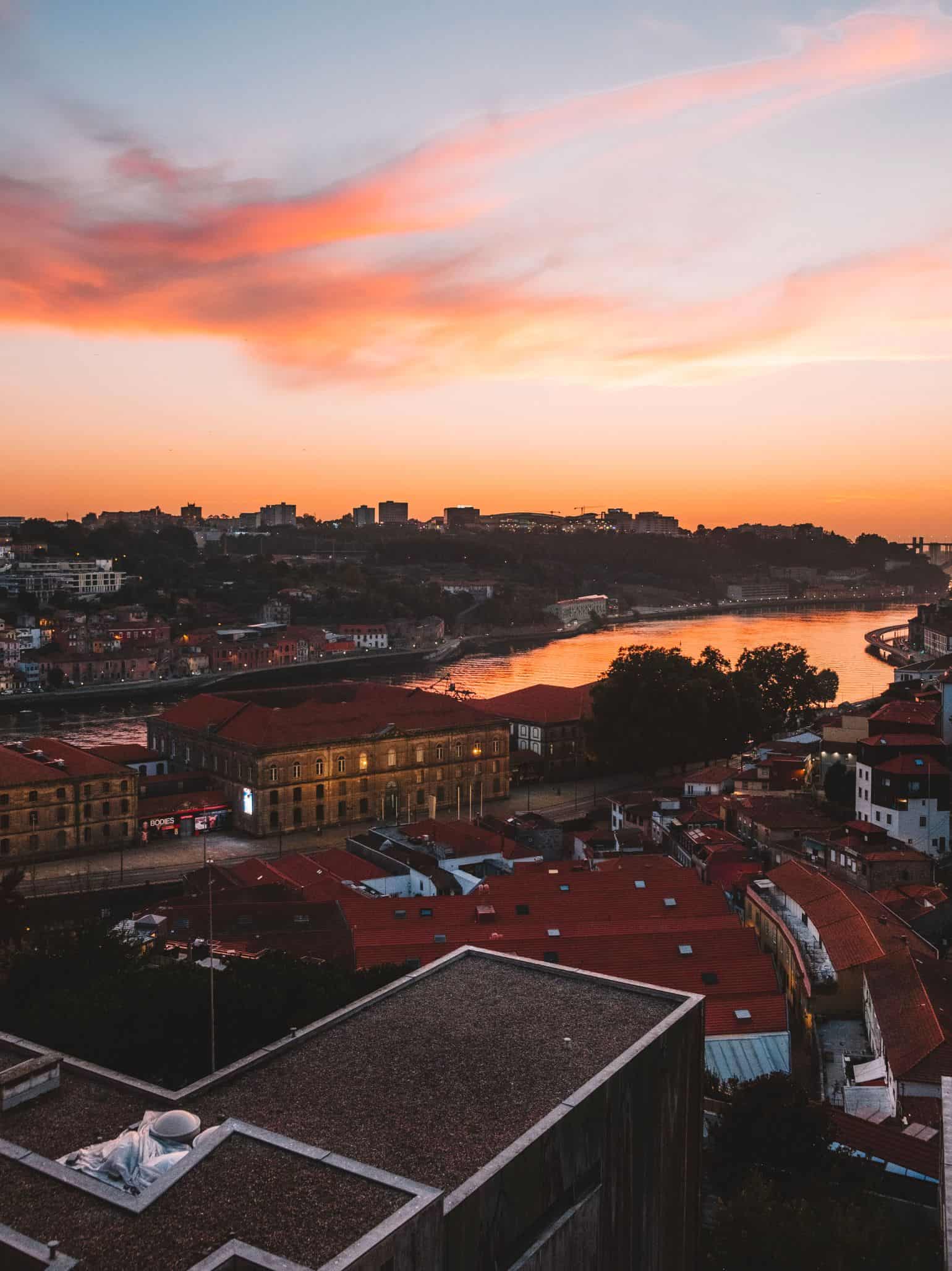 A sunset from Miradouro do Passeio das Virtudes is a must-do during your long weekend in Porto. 