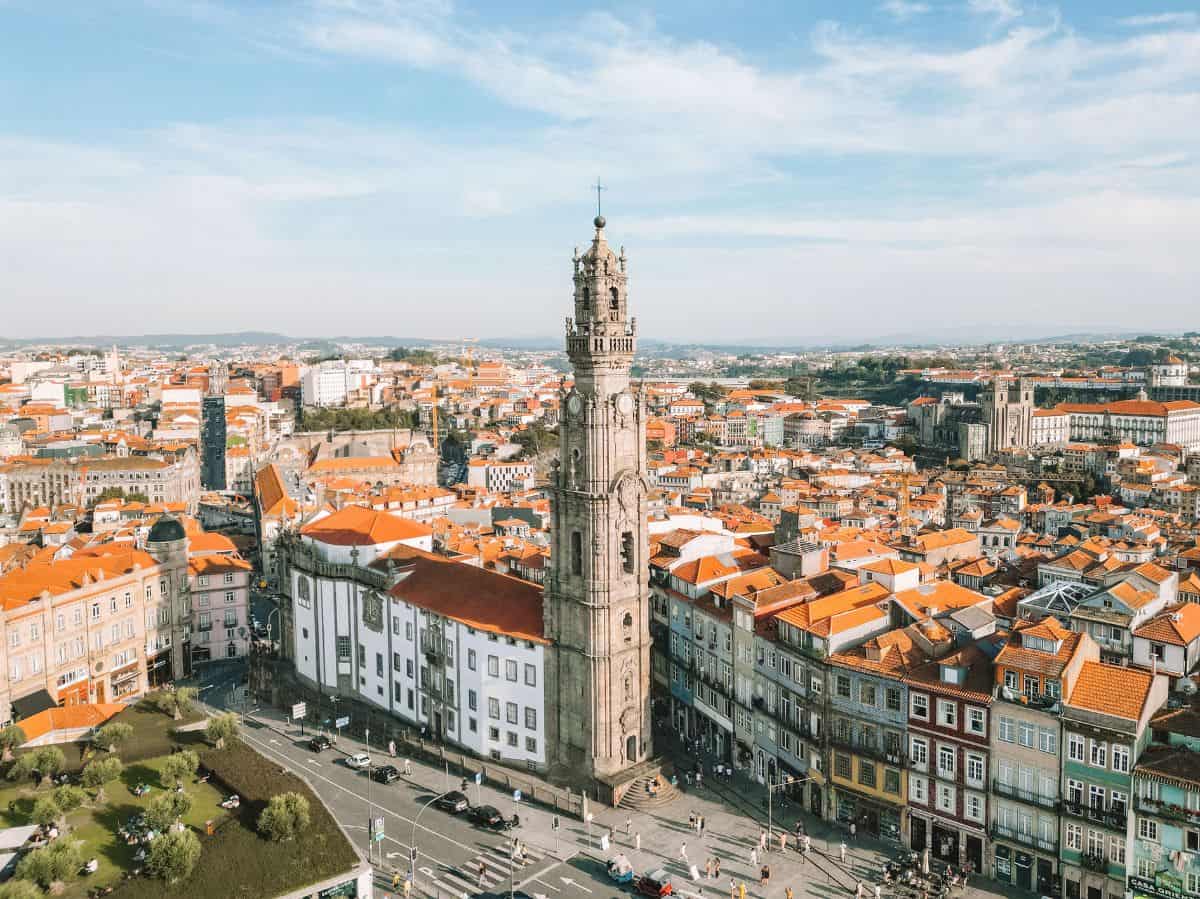 An aerial view of the Clérigos Tower in Porto. Taking in the views from the top should absolutely be on your long weekend in Porto itinerary. 