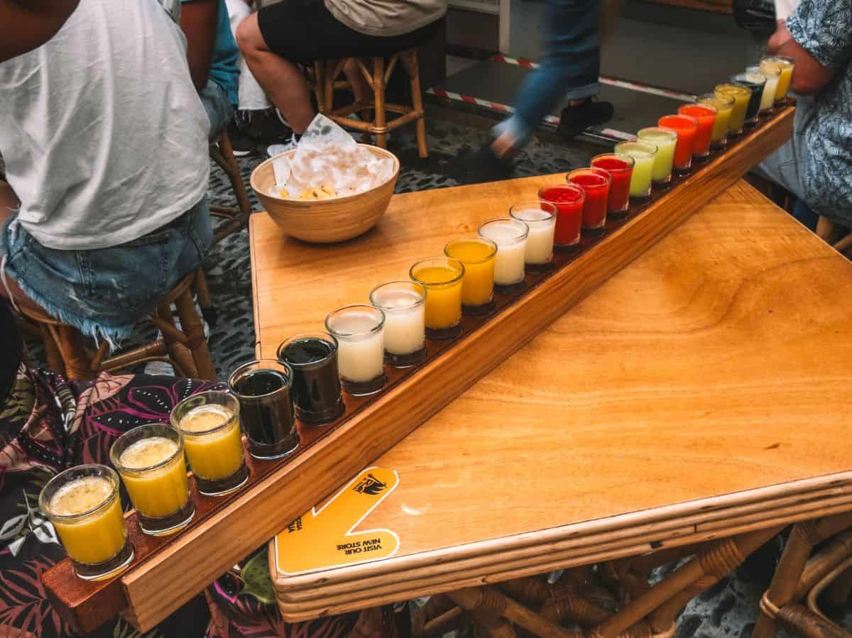 A flight of 23 shots of poncha in all different flavors from Rei da Poncha in Madeira. 